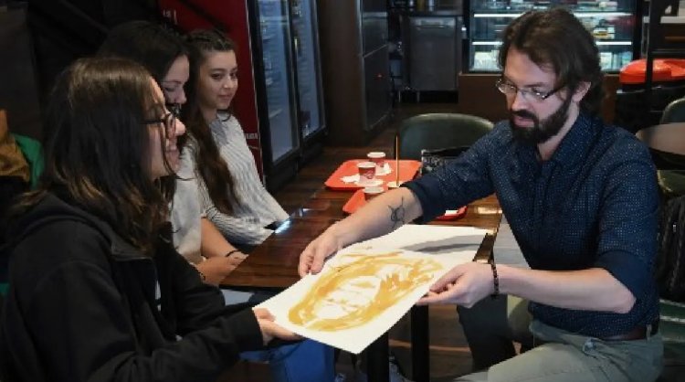 Albanian artist offers 'therapy' with portraits painted in coffee
