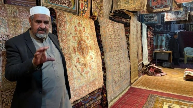 Afghan families go back to making carpets as economy unravels