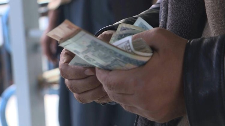 Afghan currency plunges to record low against dollar