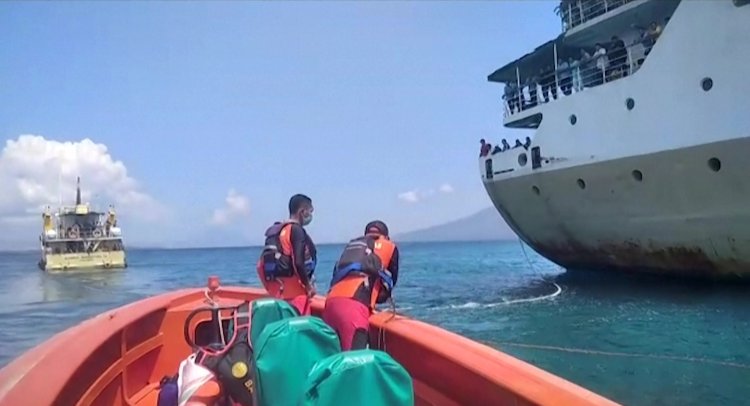 Indonesian rescuers battle to free trapped ferry carrying more than 800