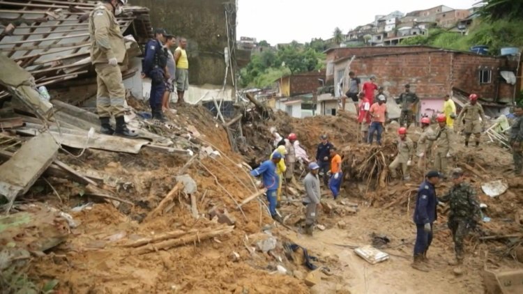 Death toll mounts from Brazil downpours as search continues