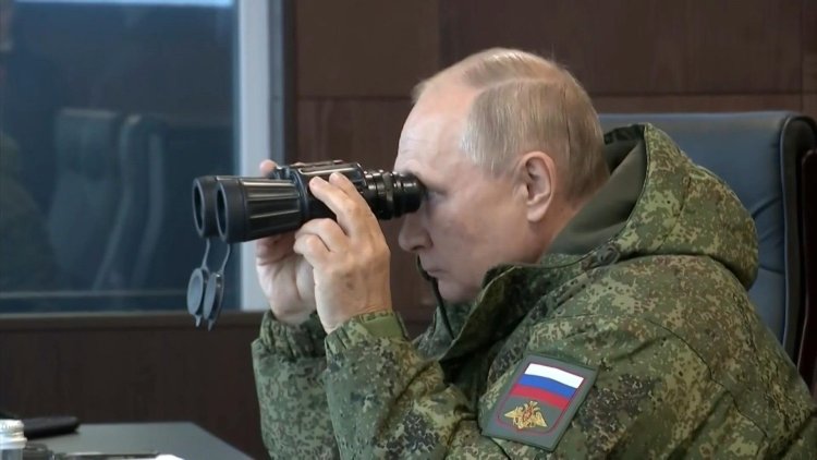 Bolstering Asia ties, Putin watches military drills with China