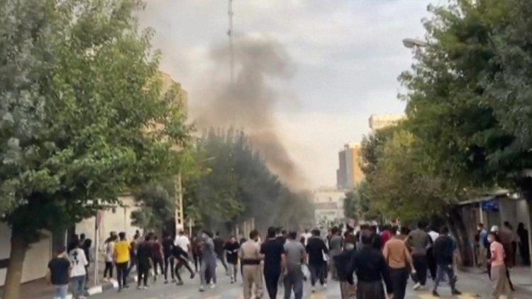 Iran protests flare as tensions grow