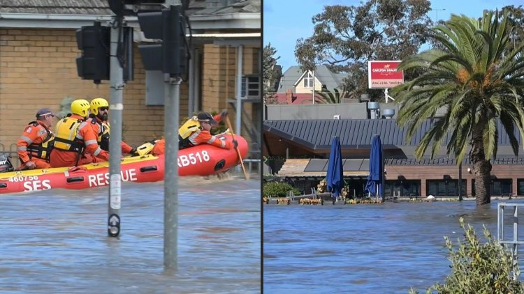 Floods swallow cars, swamp houses in 'major' Australian emergency