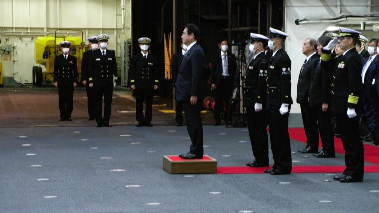 Japan PM pledges to boost military capacity