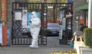 China says tracking Covid cases now 'impossible' as infections soar