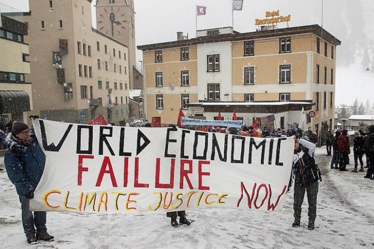 Demonstrators demand 'tax on the rich for the climate' ahead of WEF meeting