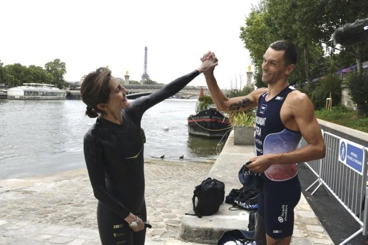 French Minister Swims in Seine Pre-Olympics