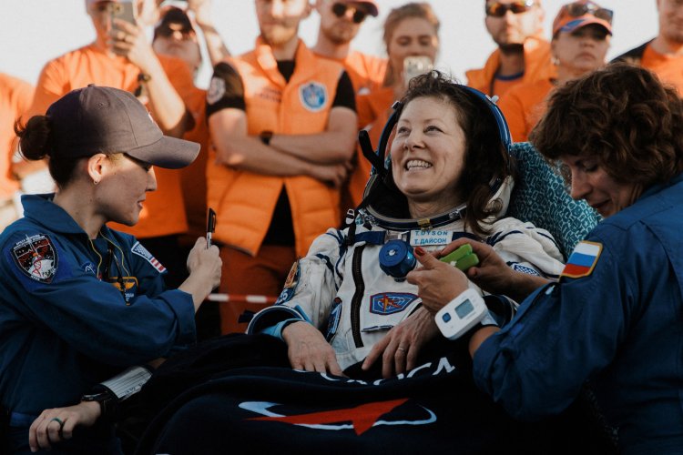 Soyuz capsule lands safely with record-setting crew