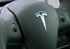 Tesla posts record sales but profits fall short
