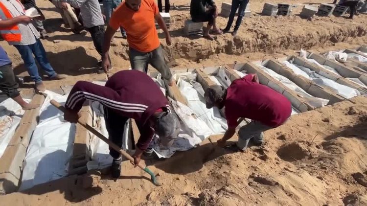 Gaza buries 54 unidentified bodies from Israel