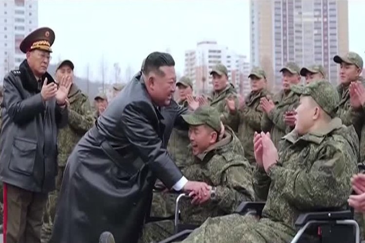 Kim praises troops back from Russia
